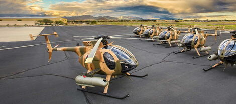 MD 530F helicopters at a hanger.