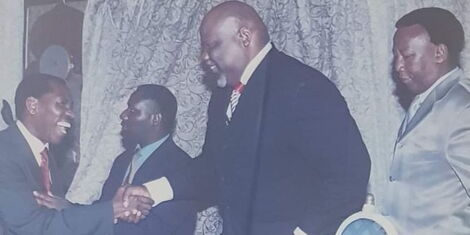 MSCK boss Ezekiel Mutua warmly shakes hands with Bishop T.D. Jakes during a press conference held at Grand Regency Hotel, alongside Bishop Mark Kariuki (in grey suit) January 19 2005