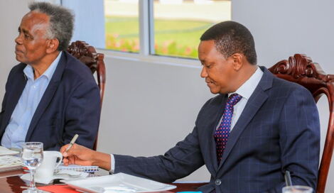 Machakos Governor Alfred Mutua (right) and a Machakos Boys High School Alumni attends a meeting on Tuesday, October 12, 2021.