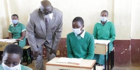 Education CS George Magoha speaks to a student at Langas Primary School in Eldoret, Uasin Gishu County on Friday, November 6, 2020