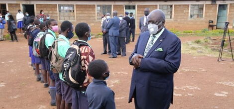 Education CS George Magoha conversing with 2020 KCPE Candidates