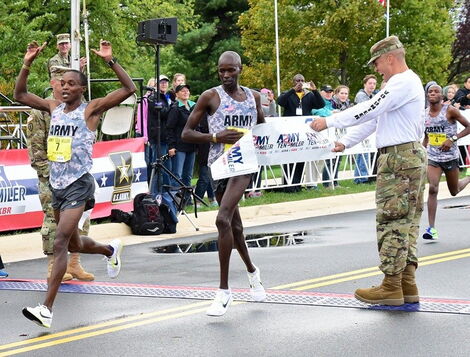Marathon runner Sgt. Augustus Maiyo (left) wins in the male’s overall and male’s military categories at the Army Ten-Miler, Oct. 9, 2016, in Arlington, USA.