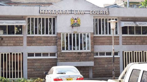 Man lies outside Makadara Law Courts in Nairobi after collapsing moments before the hearing on Thursday, August 6, 2020.