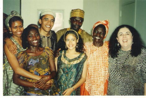A rare photo of Malik Obama (in golden headgear) with former US President Barack Obama and former first lady Michelle Obama among other relatives
