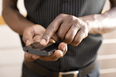 File image of a man using a phone