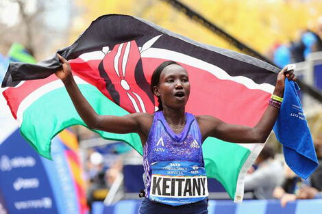 Mary Keitany celebrates after winning the Pro Women's division during the 2015 TCS New York City Marathon in Central Park on November 1, 2015