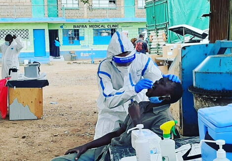 Health officer administers a Covid-19 test on a local at Biafra Medical centre in Kamukunji on Friday, May 15, 2020.