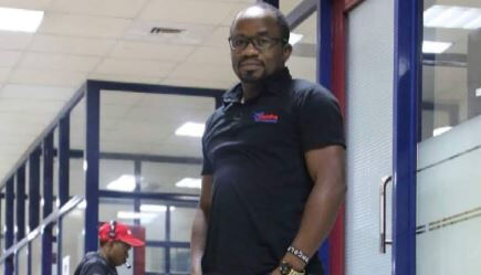 Radio Maisha presenter Mate Tongola poses for a photo inside the station's studios on September 16, 2022, 
