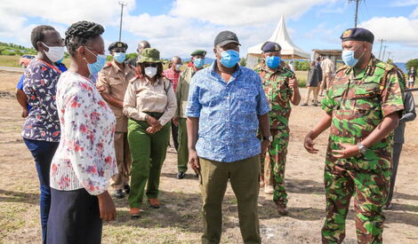 Interior CS Fred Matiang'i (centre) flanked by IG Hillary Mutyambai (right) and other security officials in Kangundo on May 1, 2020.