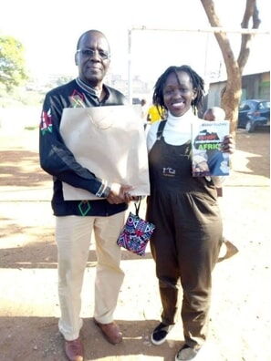 Activist Juliet Wanjira (Right) pitured receiving a donation of books from former Chief Justice Willy Mutunga