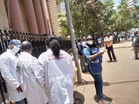 Medics conducting random screening for Covid-19 symptoms at National Archives, Nairobi on Saturday, March 21, 2020