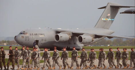 Members of the US Army walking at an airport.