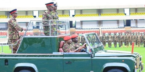 Military officers perform a mock guard of honour at Moi International Stadium Kasarani