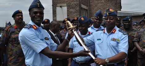 Maj Gen Mohammed Badi Ali (far left) looks on as enya Air Force Commander Maj Gen Samuel Thuita receives the Authority Sword from the former Commander Maj Gen Joff Otieno in July 2014