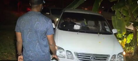 Mombasa Governor Hassan Joho stopping a vehicle during a night raid on November 8, 2020.