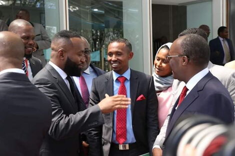 Mombasa Governor Hassan Joho greets Nyali MP Mohammed Ali as other leaders look on.