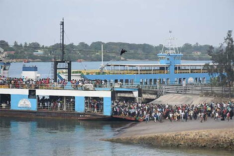 Motorists and pedestrians alight from MV Nyayo at the Likoni channel in Mombasa on January 15, 2019. 