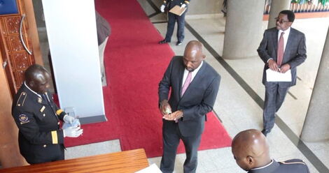 Elgeyo Marakwet Kipchumba Murkomen sanitizing his hands before entering the Senate on March 31, 2020.