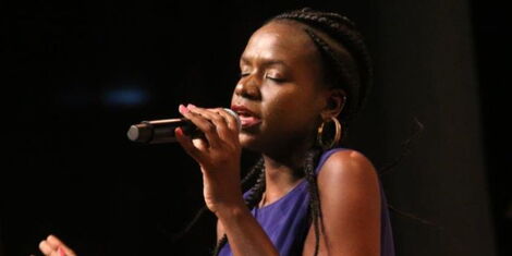 Musician Crystal Asige performs on stage during a previous concern.
