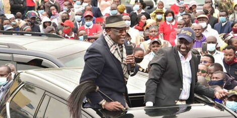 UDA Chairperson Johnstone Muthama and Deputy President William Ruto during a campaign rally.