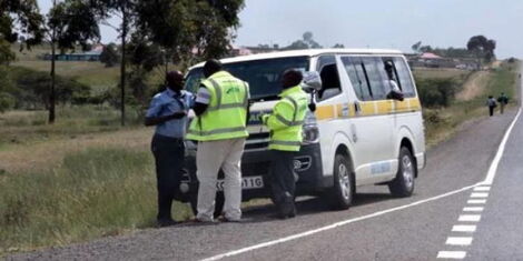 NTSA officials pictured inspecting a matatu on the Nairobi-Nakuru Highway in December 2019