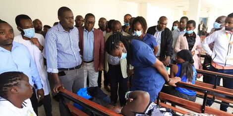 Nairobi City County Governor Johnson Sakaja interacts with a patient during a visit at the Mama Lucy Kibaki hospital on Sunday, September 11, 2022