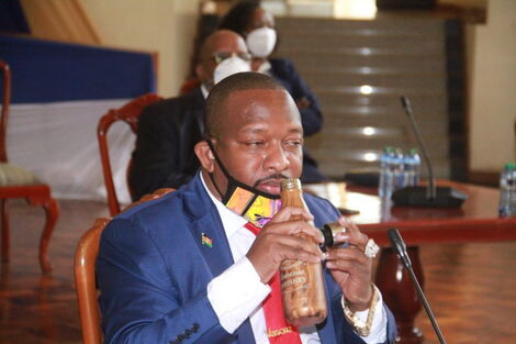 Nairobi Governor Mike Sonko drinking from a Hennessy Whisky bottle during his Senate hearing on Wednesday, July 15, 2020.