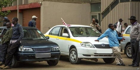 Taxi drivers in a parking lot in Nairobi 