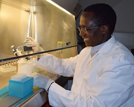 WSU professor of virology and global health Kariuki Njenga, working in his lab in Kenya, in 2017.