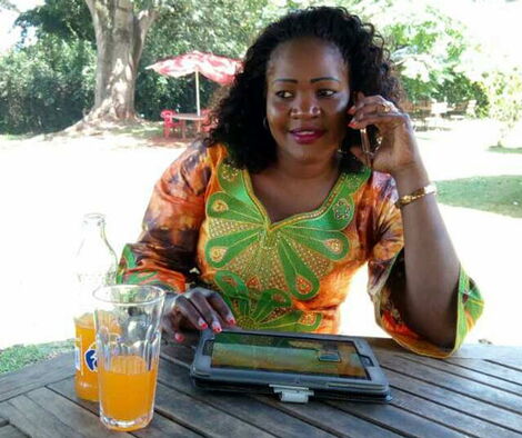 Nominated Senator Beatrice Kwamboka speaking on phone.