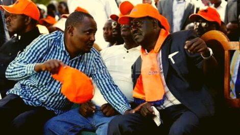 Nominted MP John Mbadi (left) speaks to former Prime Minister Raila Odinga.