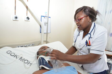 Undated Photo of a Nurse Attending to a Patient at Kenyatta National Hospital