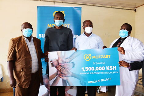 Mozzart Kenya team gives Nyamache sub-county referral hospital in Kisii a dummy check for Ksh 1.5 million