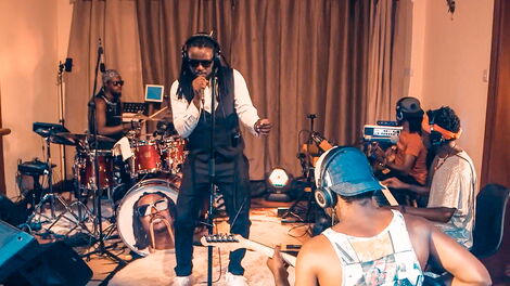 Nyashinski pictured performing from home in a show that was streamed on April 8, 2020