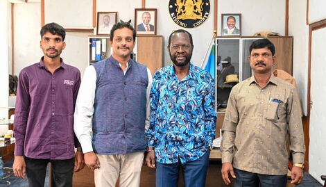 Kisumu Governor Anyang' Nyong'o posing for a photo with Indian donor on Wednesday, October 5, 2022