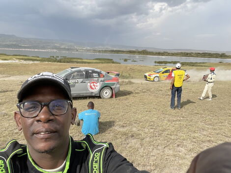 Nzioka Waita Takes a selfie next to his stalled vehicle during the World Rally Championships on June 26