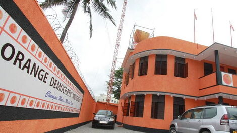Orange Democratic Movement (ODM) logo plastered on a building.