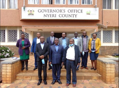 Officials pose for a photo outside the office of the Governor of Nyeri County.