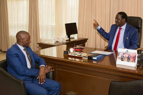 Samuel Okemwa (left) pictured during a past meeting with Orange Democratic Movement (ODM) leader Raila Odinga