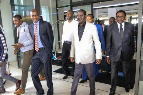 Dennis Onyango (left) with ODM leader Raila Odinga (centre) and Siaya Senator James Orengo.