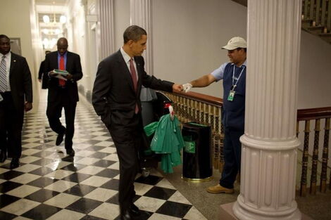 Images of former US President Barrack Obama fist thumbing with a staff member at the Eisenhower Executive Office Building.