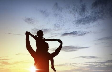 A silhoutte of a girl and her father. 