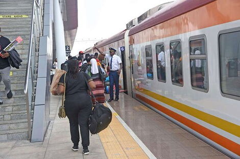 Passengers travel to Mombasa using a Madaraka Express train at the Nairobi terminus in Syokimau.