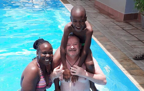 Patrick Kinsella, his wife Mary Atieno and stepson Ramsey Dickson enjoy some quality time in a swimming pool.