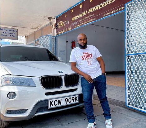 Patrick Mwangi poses with some of the vehicles he has sold