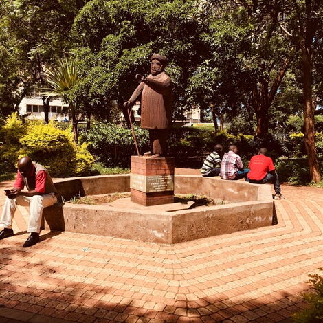 People rest at Jeevanjee Gardens in Nairobi