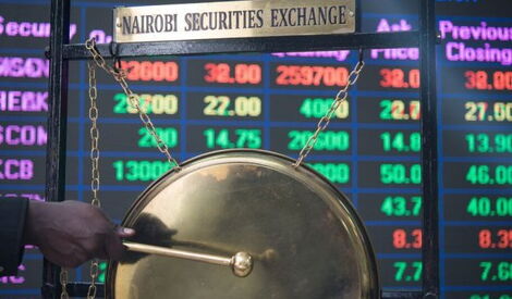 Person rings the bell on the floor of Nairobi Stock Exchange (NSE)