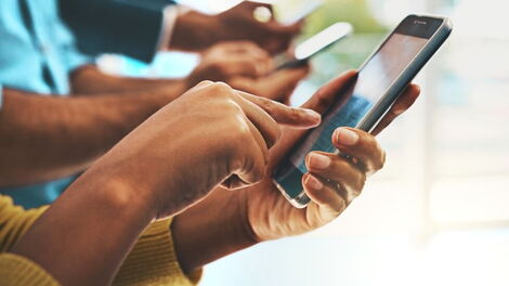File image of Kenyans using smartphones