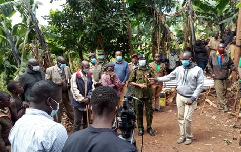 Police officers at Henry Nyabuto's home in Kisii.