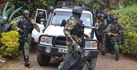 Police officers at a scene in a previous incident